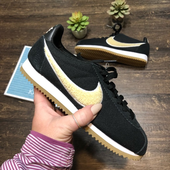 nike cortez black and gold womens